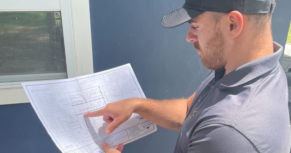 Professional contractor reviewing a home improvement project plan